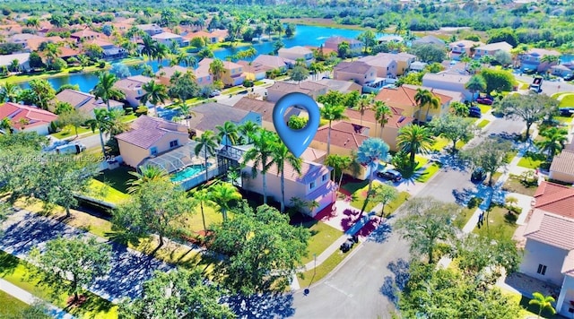 birds eye view of property featuring a water view