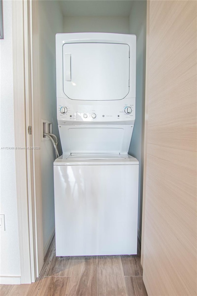 laundry room featuring stacked washing maching and dryer