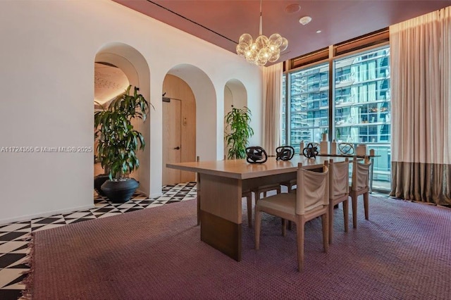 dining area featuring a notable chandelier