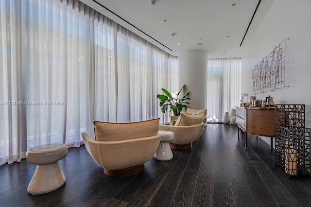 living area with hardwood / wood-style floors