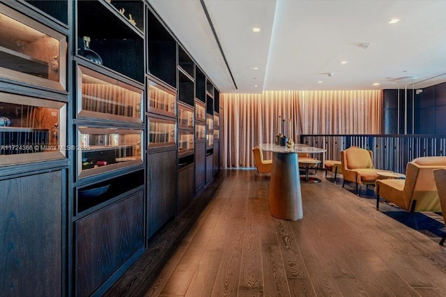 kitchen featuring a center island with sink and dark hardwood / wood-style flooring