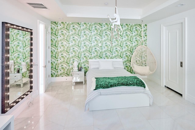 tiled bedroom with a tray ceiling