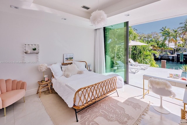 bedroom featuring floor to ceiling windows, access to exterior, and light tile patterned floors