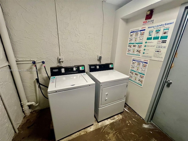 clothes washing area featuring separate washer and dryer