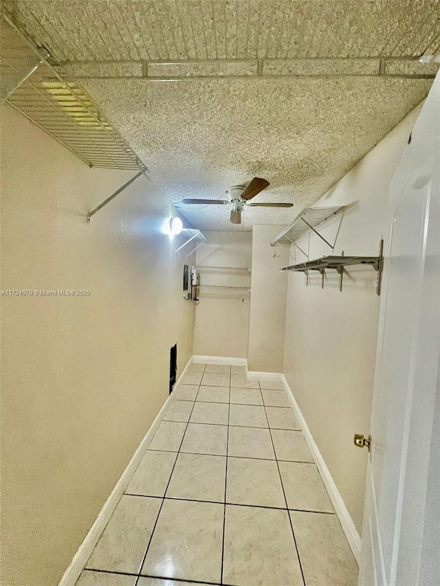 spacious closet featuring tile patterned floors