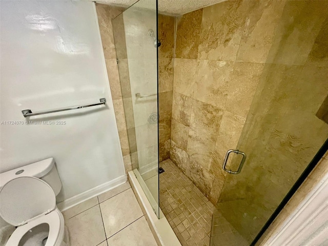 bathroom with toilet, a shower with door, and tile patterned flooring