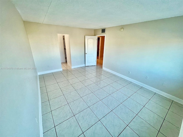 empty room with a textured ceiling