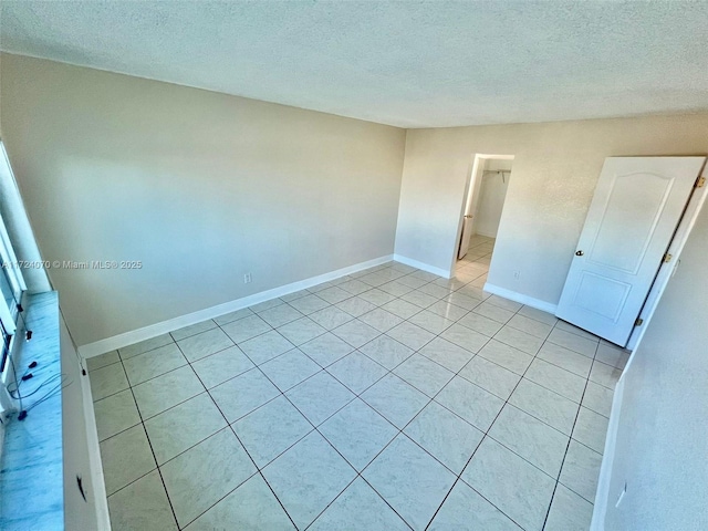 empty room with a textured ceiling