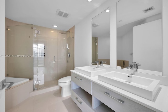 full bathroom with vanity, tile patterned flooring, shower with separate bathtub, and toilet