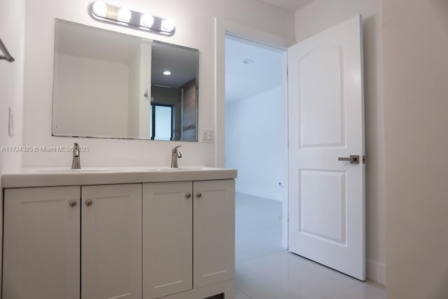 bathroom with tile patterned flooring and vanity