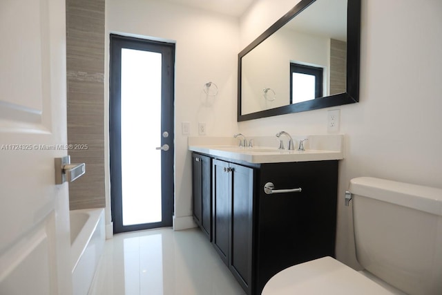 bathroom with toilet and vanity