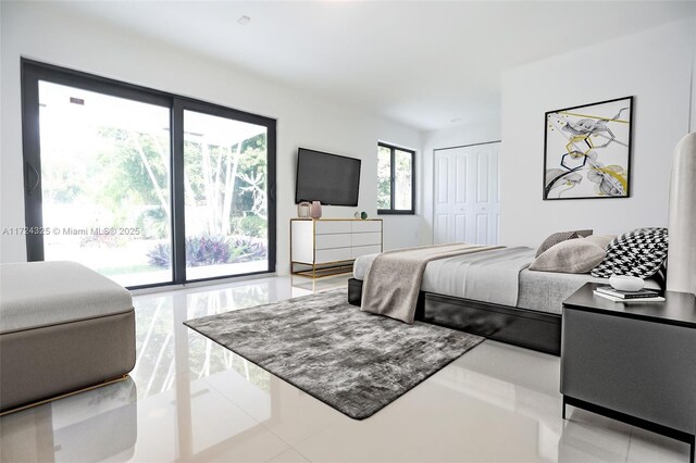 tiled bedroom featuring a closet