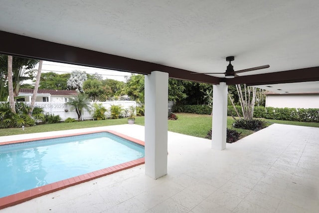 view of pool featuring ceiling fan and a patio