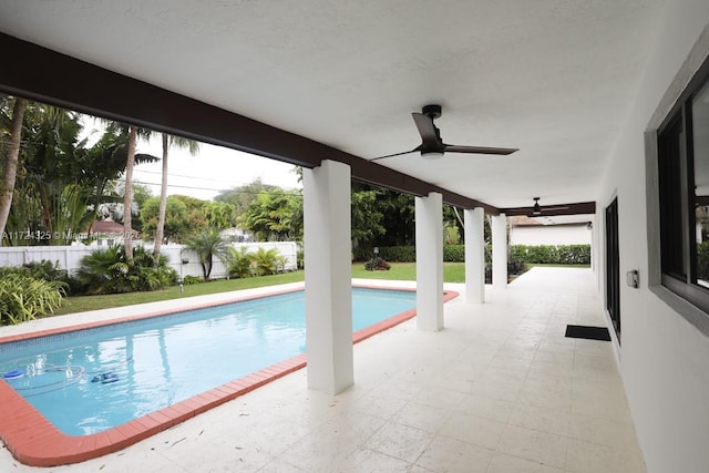 view of pool featuring ceiling fan