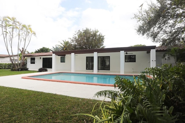 view of pool featuring a patio area and a lawn