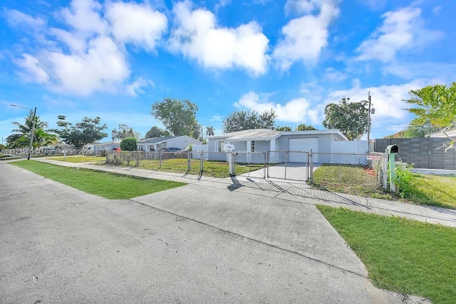 view of front of property with a front lawn and a garage