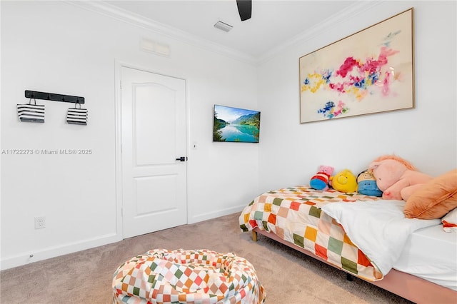 carpeted bedroom featuring ceiling fan and ornamental molding