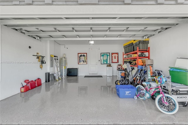 garage with electric panel and water heater