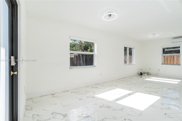 spare room featuring an AC wall unit