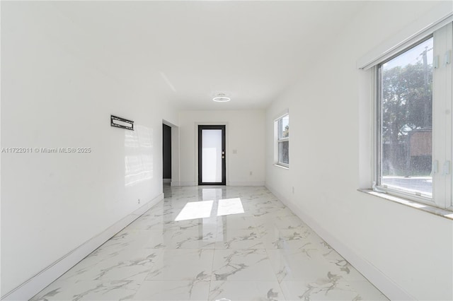 hallway featuring plenty of natural light