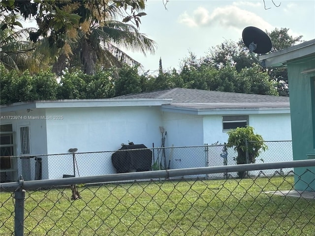 view of home's exterior with a lawn