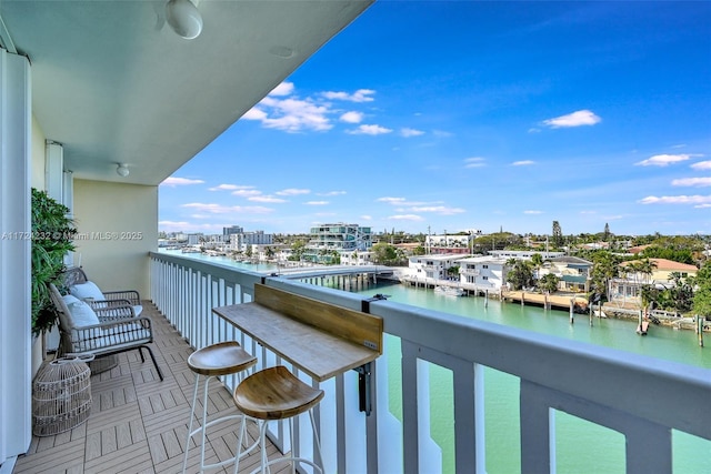 balcony featuring a water view