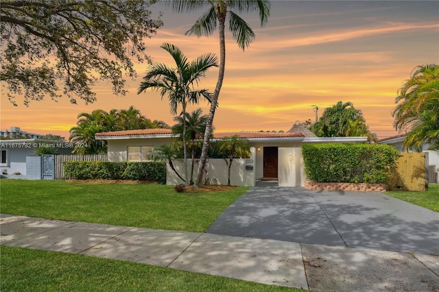 view of front of property with a lawn