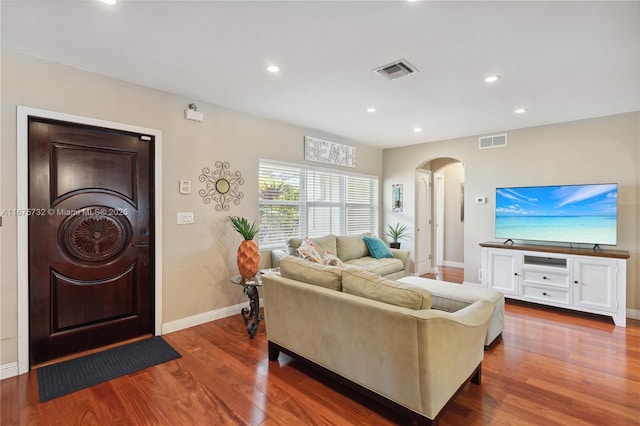 living room featuring dark hardwood / wood-style flooring