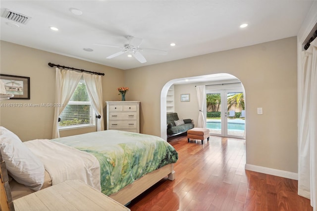 bedroom with hardwood / wood-style flooring, ceiling fan, and access to exterior