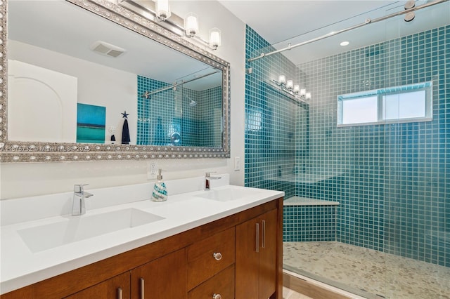 bathroom with a shower and vanity