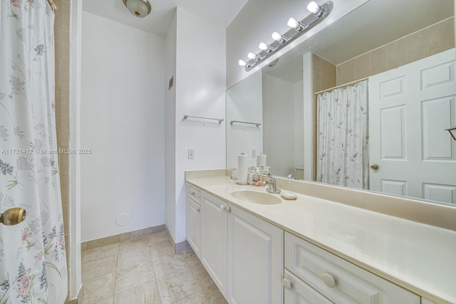 bathroom with vanity and walk in shower