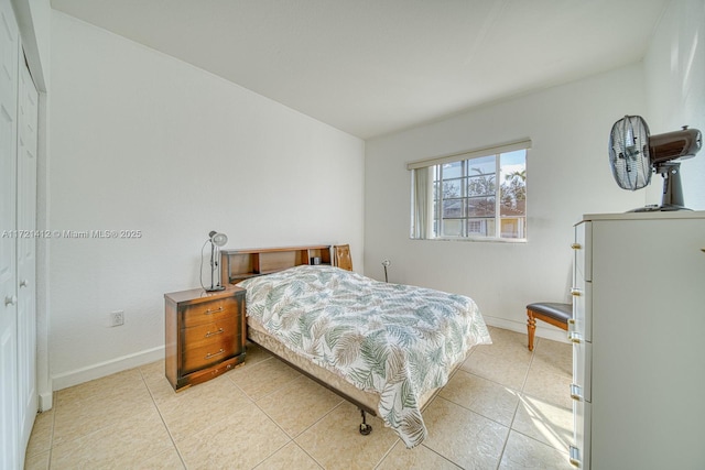 bedroom featuring light tile patterned floors