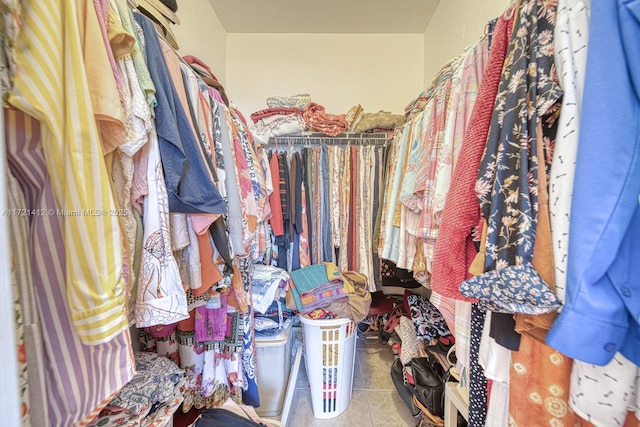 spacious closet featuring tile patterned floors