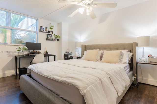 bedroom featuring a textured ceiling, dark hardwood / wood-style flooring, and ceiling fan