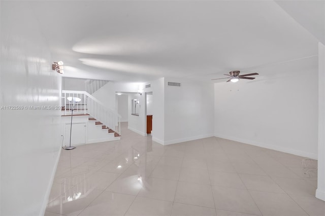 unfurnished living room featuring ceiling fan