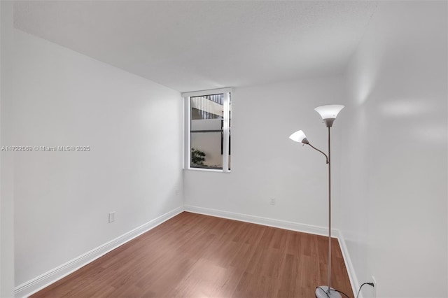 spare room featuring hardwood / wood-style flooring