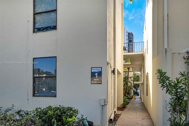 20291 NE 30th Ave Unit 108, Aventura, FL 33180 - view of side of home featuring stucco siding