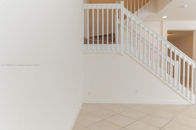 stairs featuring tile patterned floors