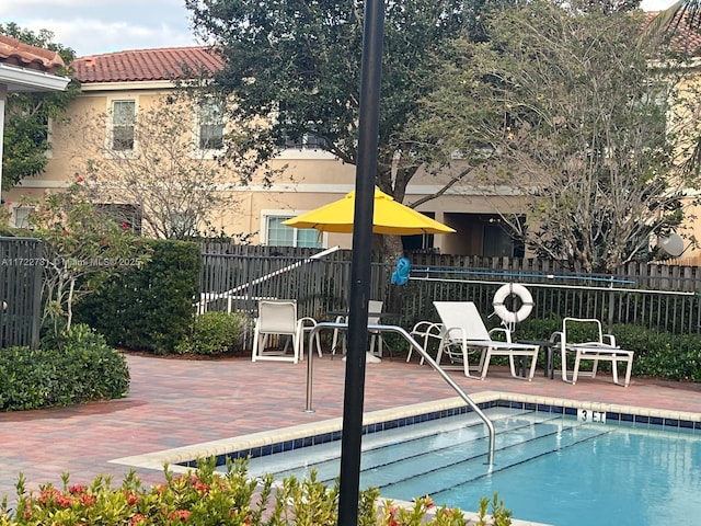 view of swimming pool featuring a patio