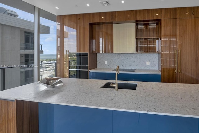 2655 S Bayshore Dr Unit 1212, Coconut Grove, FL 33133 - kitchen featuring tasteful backsplash, a sink, a water view, modern cabinets, and recessed lighting