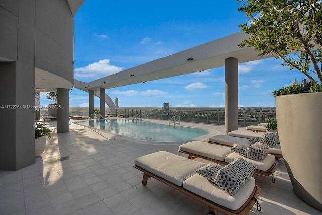 view of swimming pool featuring a patio