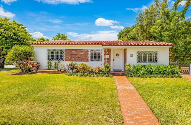 view of front of home with a front yard