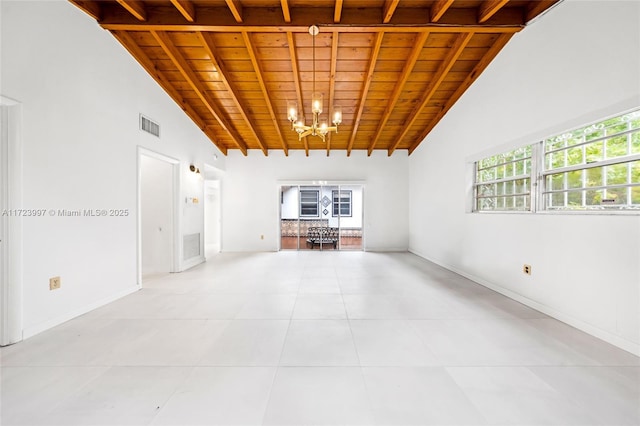 unfurnished room featuring beamed ceiling, a notable chandelier, and wood ceiling