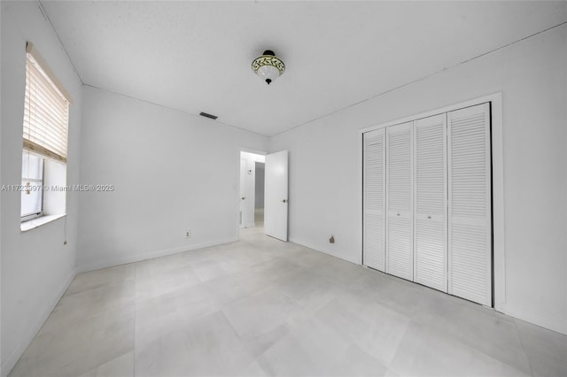 unfurnished bedroom featuring a closet