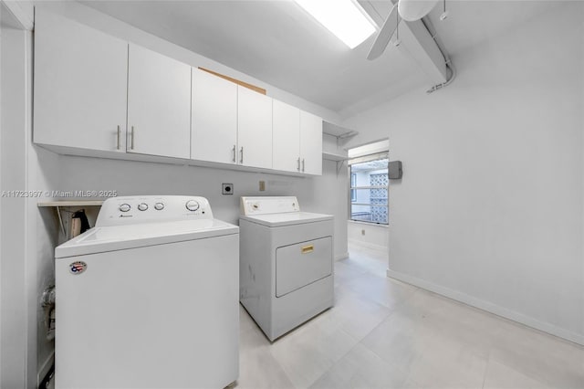 clothes washing area with cabinets, independent washer and dryer, and ceiling fan