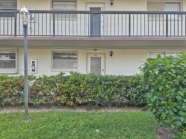 property entrance with a balcony