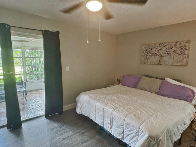 bedroom with ceiling fan and dark hardwood / wood-style flooring