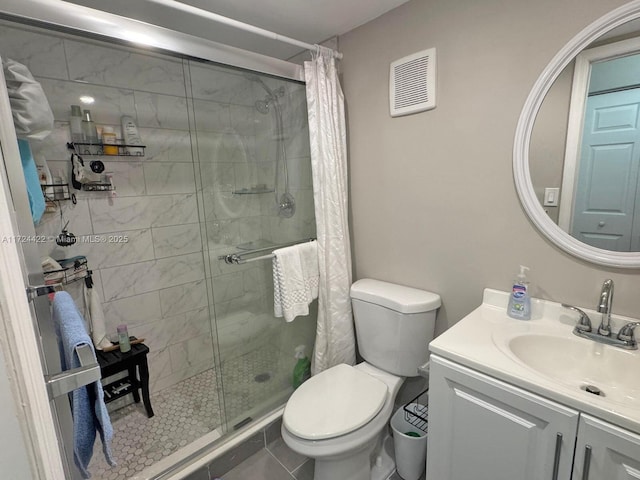 bathroom featuring a shower with shower curtain, vanity, tile patterned floors, and toilet