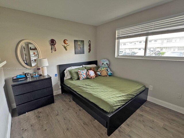 bedroom with wood-type flooring