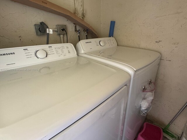 laundry area with independent washer and dryer